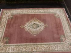 A Chinese large rug with pink ground (460cm x 310cm)
