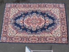 A group of five matching blue ground rugs (largest 290 x 190cm)