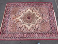 A large rug with red ground (363 x 271cm))
