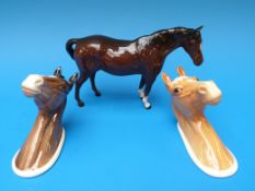 Two Beswick horses head wall plaques 1382 and 1384,