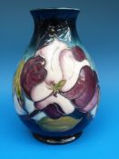 A W M Moorcroft vase decorated in a variation of 