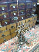 A Georgian spinning wheel with turned supports, six spoke wheel and bone or ivory finials,