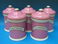 A set of five apothecary jars, all with liners, pink ground,
