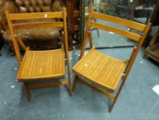 Two pine folding chairs