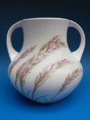 A large 1930s Moorcroft twin-handled vase decorated in 