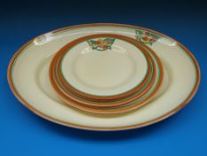 A Clarice Cliff honeyglaze meat plate and six graduated smaller plates (pattern 8275)