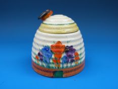 A Clarice Cliff honey pot with bee finial to the lid,