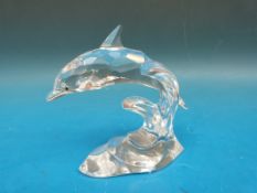 Swarovski crystal dolphin jumping from waves.