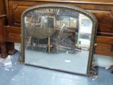 A gilt framed arch topped over mantel mirror (W128,