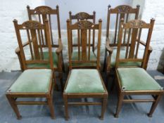 Six oak framed chairs with carved decoration in the Art Nouveau style (comprising four dining
