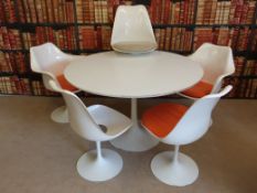 An Eero Saarinen 'Tulip' table and four chairs (2 + 2) and one further seat top