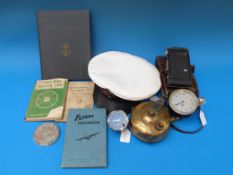 A vintage Smiths car clock, travelling optimus stove, flight handbook (second edition),