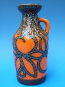 A German lava pottery ewer (18cm high)