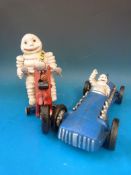A replica Michelin figure in a racing car and a similar example on a motorbike