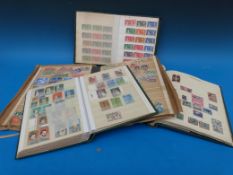 Three stock books and a Simplex album.