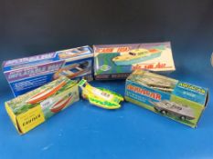 A collection of model boats to include battery operated cruiser, Aquacar, cabin boat,