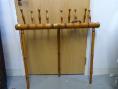A 19thC boxwood quoits game with scores marked next to pegs and further removable section with