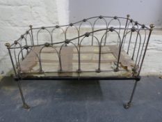 A child's brass and steel daybed on castors (L122, W62,