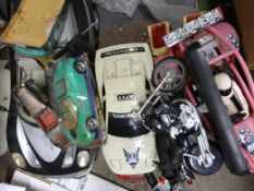 A collection of large scale model cars some battery operated.