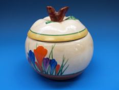 A Clarice Cliff preserve pot with branch finial to lid,