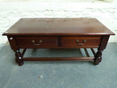 A two-drawer coffee table (W107, D51,