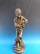 A large bronzed spelter figure of a boy fishing,