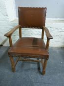 An oak rocking chair together with similar armchair