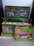 Four Siku diecast model farm vehicles all in original boxes