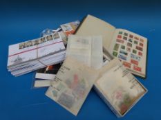 An album of colonial stamps, various loose stamps,