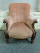 A Victorian mahogany upholstered armchair