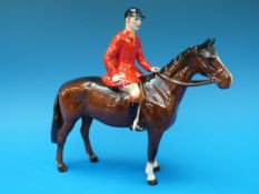 A Beswick standing huntsman