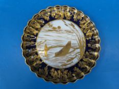A very fine Copeland china cabinet plate with gilded decoration of a fisherman landing a fish,