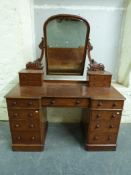 A 19thC mahogany dressing chest with swing frame mirror flanked by two small drawers to each side,