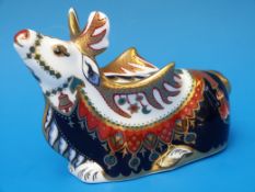A boxed Royal Crown Derby paperweight in the form of a reindeer with gold stopper