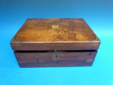 A late Victorian burr walnut work box with brass corner mounts and writing slope