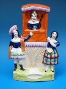 A rare 19thC Staffordshire flatback figure of a Punch and Judy show,