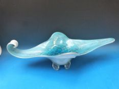 A large Murano blue glass dish raised on four feet with aventurine decoration (63cm in diameter)