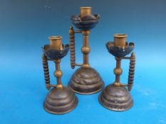 Three copper chambersticks by Christopher Dresser / Benham and Froud