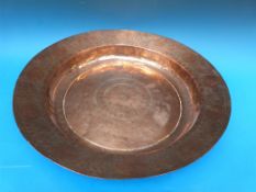 A large hammered copper Arts & Crafts charger