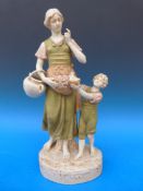 A large Royal Dux figure of mother and child (40cm tall)