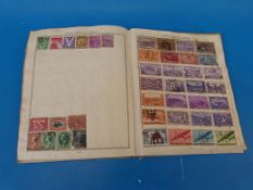 A boys Triumph stamp album (well filled) of all world stamps