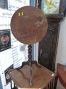 A 19thC tilting mahogany occasional table (D44cm,