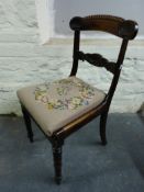 A set of four 19thC carved mahogany and rosewood upholstered chairs