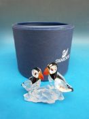 Swarovski crystal model of two puffins on a rock in original box