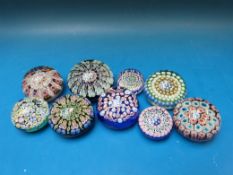 Nine paperweights by Peter McDougal,
