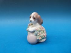 A Lladro figurine of a dog 