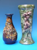 Two large Longpark Pottery vases with applied and relief floral decoration