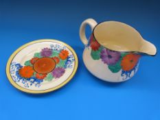 A large squat Clarice Cliff jug and underplate both decorated in the 