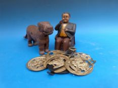 An American money box in the form of a politician pocketing money,