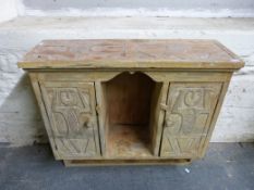 A carved wall mounted shelf unit,